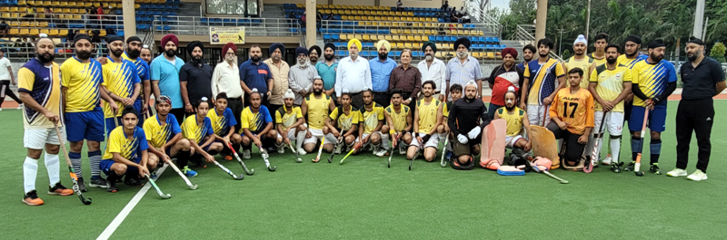 Guests and match officials posing with winning hockey team at KK Hakku Stadium, Jammu. Guests and match officials posing with winning hockey team at KK Hakku Stadium, Jammu.