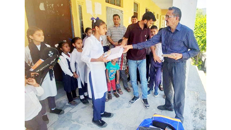 SDM Virender Gupta distributing sports material among students in the Chowki Choura area on Friday. SDM Virender Gupta distributing sports material among students in the Chowki Choura area on Friday.