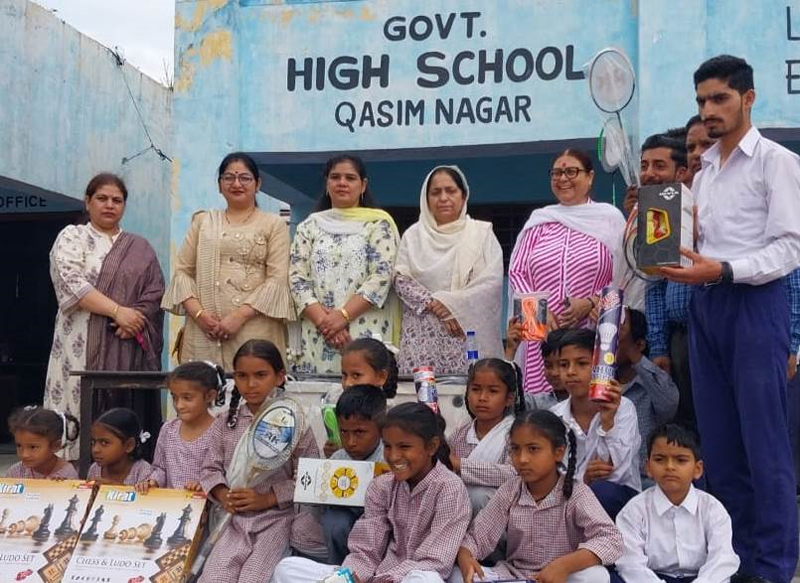 Students posing with sports items provided by the NGO Unnat at GHS Qasim Nagar, Jammu. Students posing with sports items provided by the NGO Unnat at GHS Qasim Nagar, Jammu.