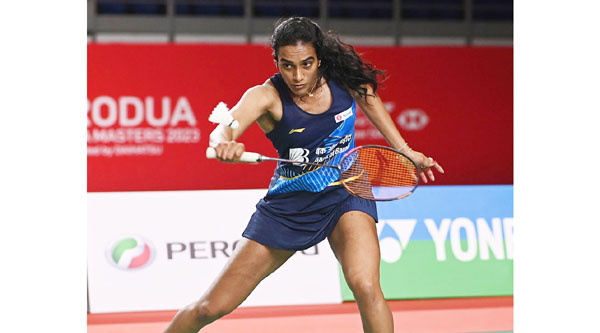Pusarla V. Sindhu competes during the women's singles quarterfinal match against Zhang Yiman of China at the Malaysia Masters 2023 in Kuala Lumpur.  (UNI)