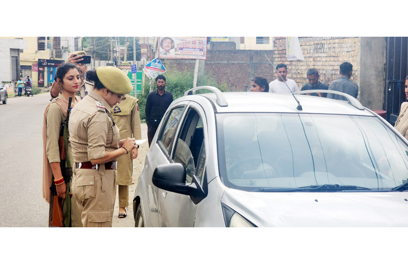 Women police officials deployed in anti drug drive, checking vehicles in Samba on Friday.