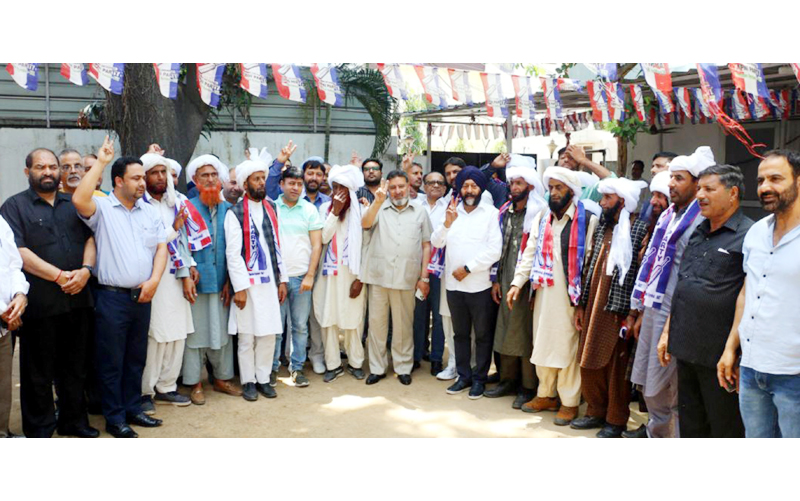 Apni Party president Altaf Bukhari welcoming new entrants from NC into his own party in Jammu on Thursday.
