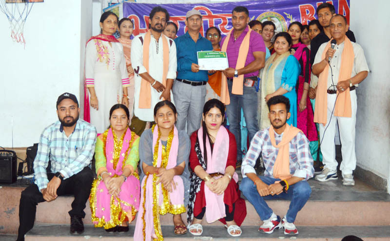 Artists of BLSKS posing for a group photograph during a programme on Friday.