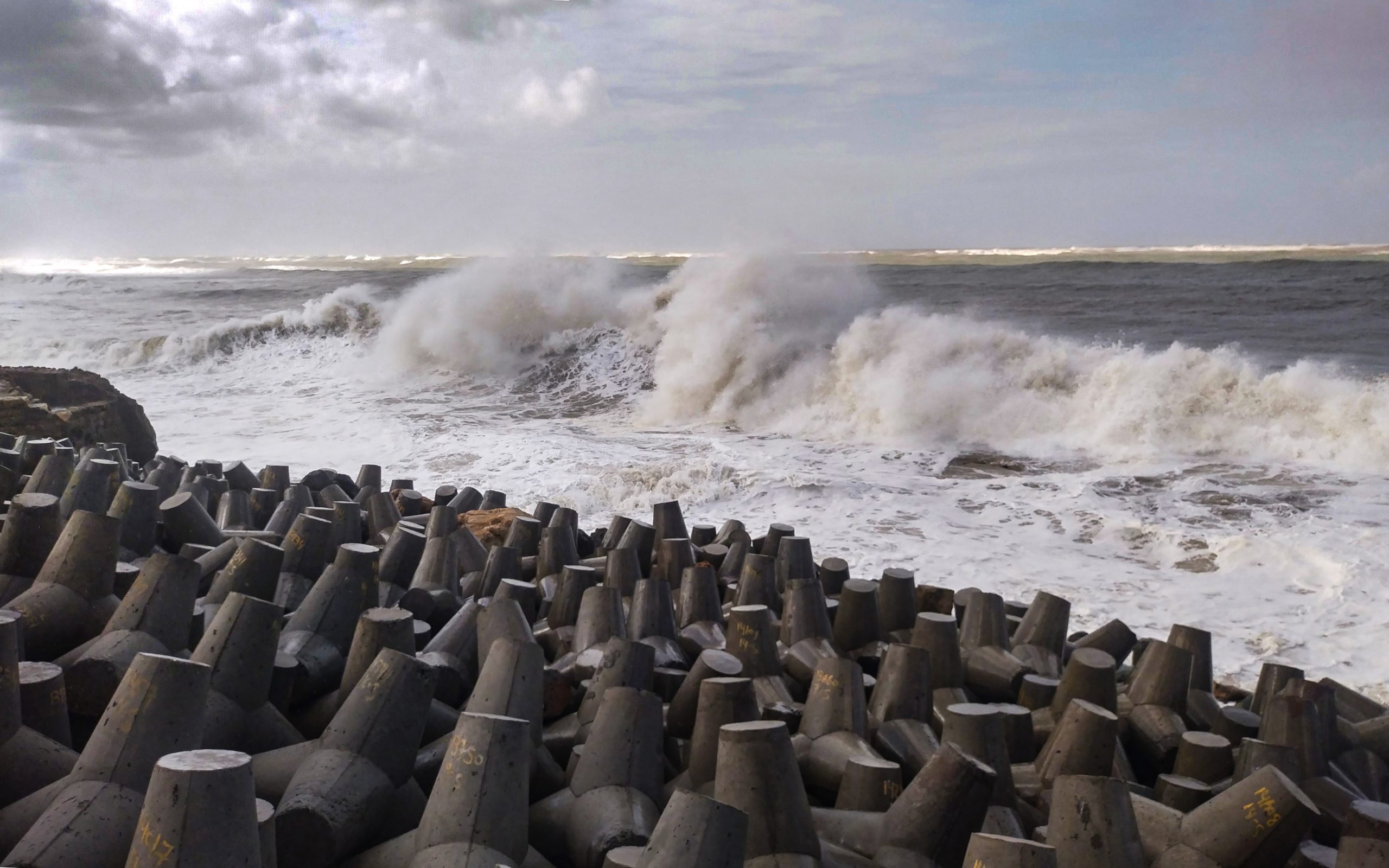 Cyclone Biparjoy: Preparations at Porbander High waves crash against the jetty at a fishing harbour ahead of the expected landfall of Cyclone Biparjoy, in Porbander, Gujarat, Sunday.
