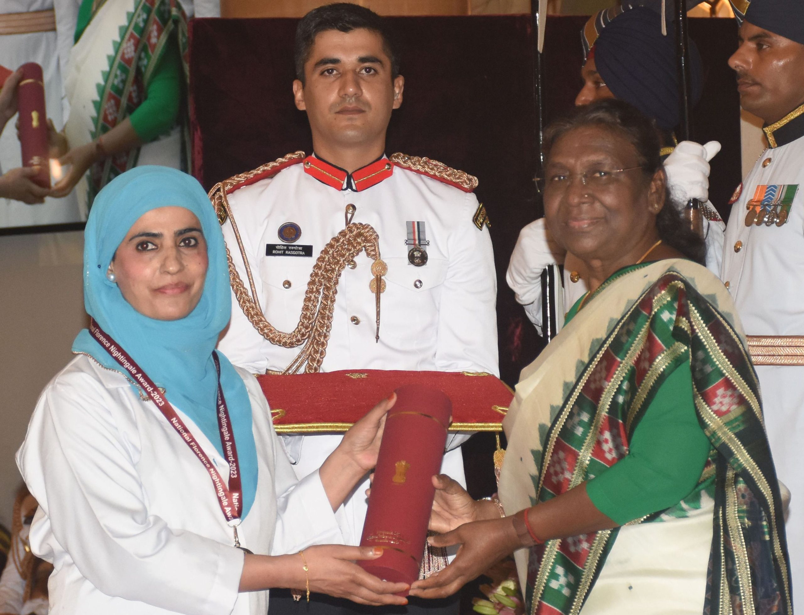 22JUNDK25U President Droupadi Murmu presenting the National Florence Nightingale Award 2023 to Firdousa Jan, Staff Nurse Grade-1 Sher-e-Kashmir Institute of Medical Sciences, Srinagar at Rashtrapati Bhawan on Thursday (UNI).