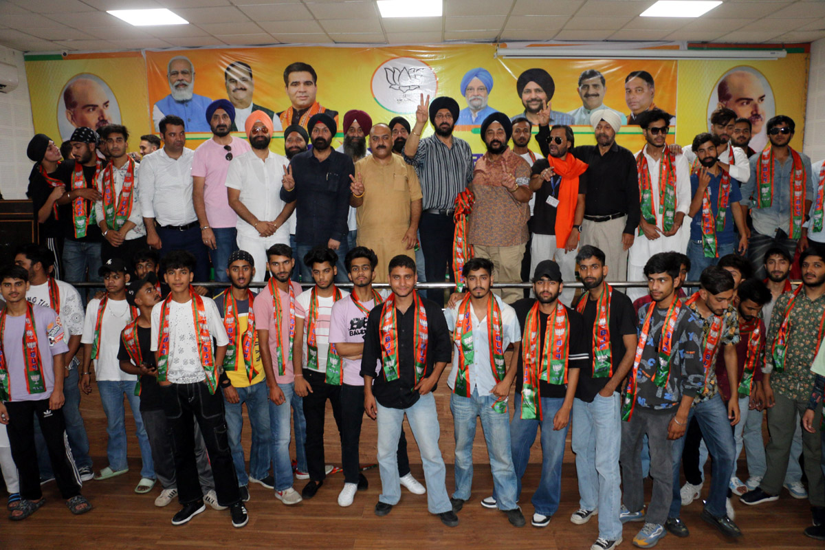 BJP leaders posing with new entrants at Party Headquarters in Jammu. BJP leaders posing with new entrants at Party Headquarters in Jammu.