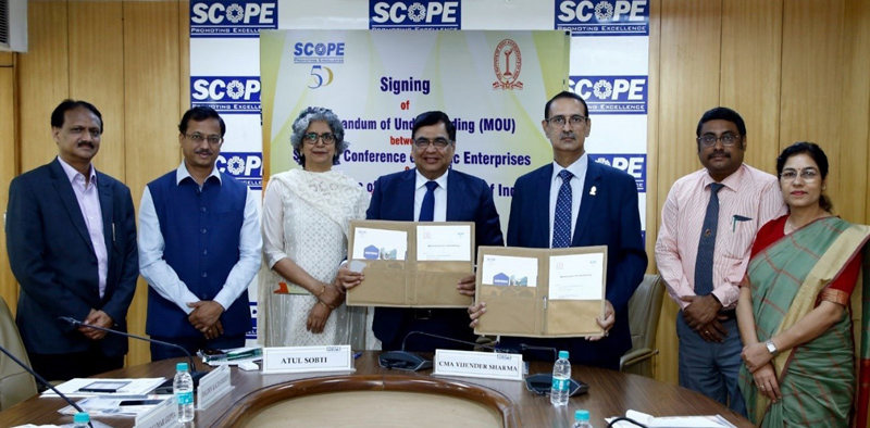 Director General SCOPE and President of Institute of Cost Accountants of India displaying copies of MoU signed between the two institutes. Director General SCOPE and President of Institute of Cost Accountants of India displaying copies of MoU signed between the two institutes.