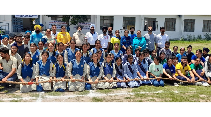 Different teams of Tug of War poses for group photograph in Jammu on Tuesday. Different teams of Tug of War poses for group photograph in Jammu on Tuesday.