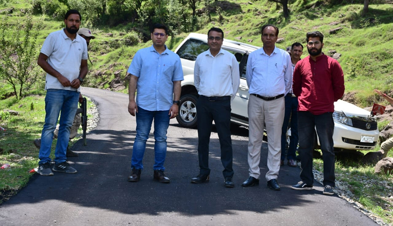 DC Rajouri Vikas Kundal inspecting progress on PMGSY road. DC Rajouri Vikas Kundal inspecting progress on PMGSY road.
