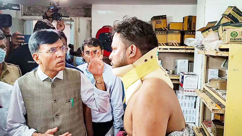 Union Health Minister Mansukh Mandaviya meets an injured at Capital Hospital following Friday's accident involving three trains, in Bhubaneswar.