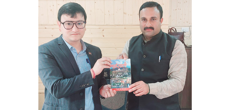 Mahant Rohit Shastri presenting a book to MD JKTDC Minga Sherpa during a meeting in Srinagar. Mahant Rohit Shastri presenting a book to MD JKTDC Minga Sherpa during a meeting in Srinagar.