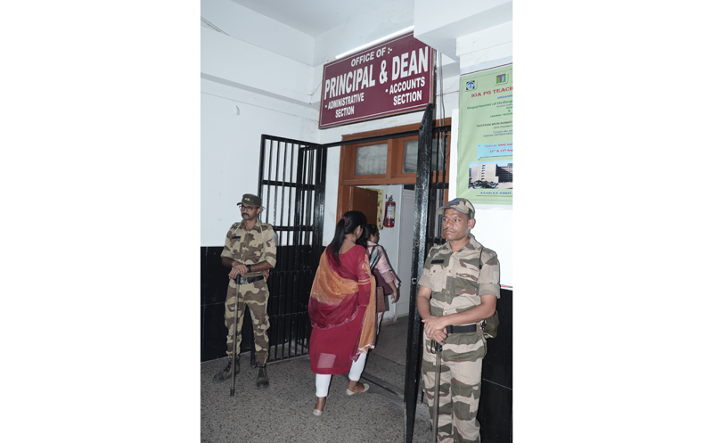 Paramilitary personnel stand guard during the Crime Branch raids at GMC-J Principal Dr Shashi Sharma’s office on Thursday. Paramilitary personnel stand guard during the Crime Branch raids at GMC-J Principal Dr Shashi Sharma’s office on Thursday.
