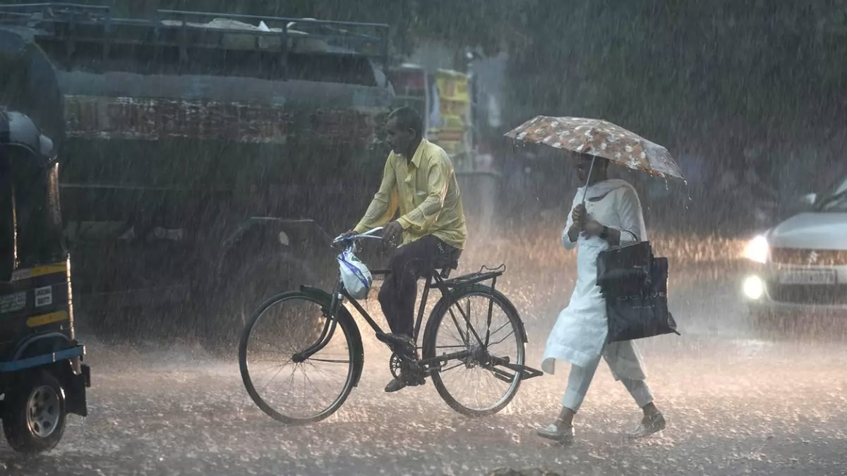 A woman walks in the rain in Jammu. (FilePic)