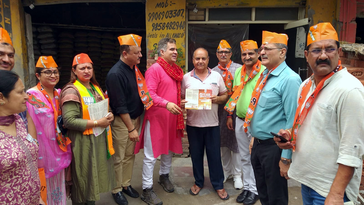 BJP leaders during door to door campaign in Trikuta Nagar on Wednesday. BJP leaders during door to door campaign in Trikuta Nagar on Wednesday.