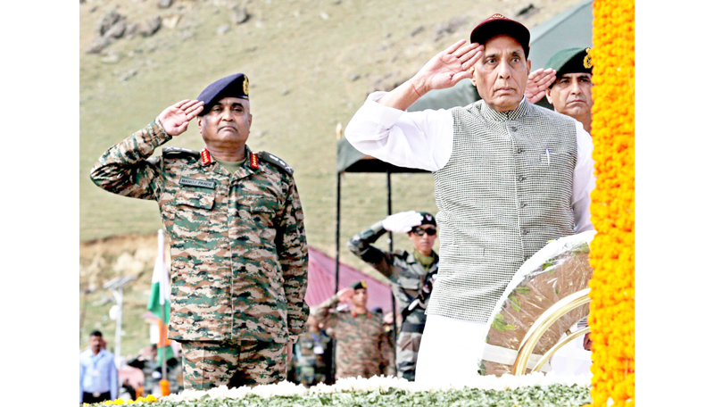 Defence Minister Rajnath Singh and Army chief Gen Manoj Pande paying homage to Kargil war martyrs at Drass on Wednesday. Another pic on page 3. -Excelsior Basharat Ladakhi Defence Minister Rajnath Singh and Army chief Gen Manoj Pande paying homage to Kargil war martyrs at Drass on Wednesday. Another pic on page 3. -Excelsior Basharat Ladakhi