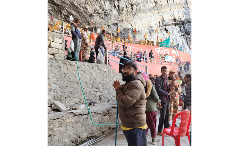 Yatris waiting for darshan at holy cave on Sunday. Another pic on page 4. —Excelsior/Shakeel Yatris waiting for darshan at holy cave on Sunday. Another pic on page 4. —Excelsior/Shakeel