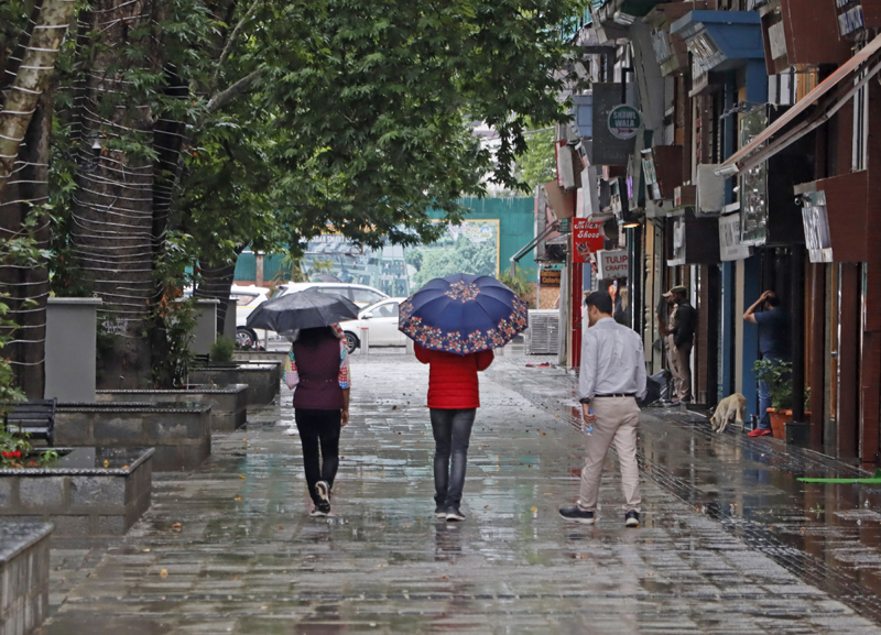People walk through the Polo View Market, carrying umbrellas on a rainy day in Srinagar on Friday. —Excelsior/Shakeel People walk through the Polo View Market, carrying umbrellas on a rainy day in Srinagar on Friday. —Excelsior/Shakeel