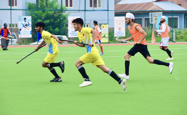 Hockey players in action during a match in Pulwama on Thursday. Hockey players in action during a match in Pulwama on Thursday.