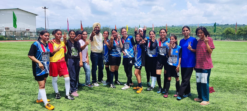 Under-17 girls Football team of Poonch celebrating victory while posing for photograph with their coach in Jammu. Under-17 girls Football team of Poonch celebrating victory while posing for photograph with their coach in Jammu.