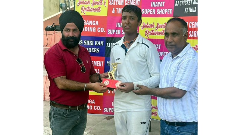 Karan Veer Sharma receiving trophy from dignitaries in Kathua. Karan Veer Sharma receiving trophy from dignitaries in Kathua.