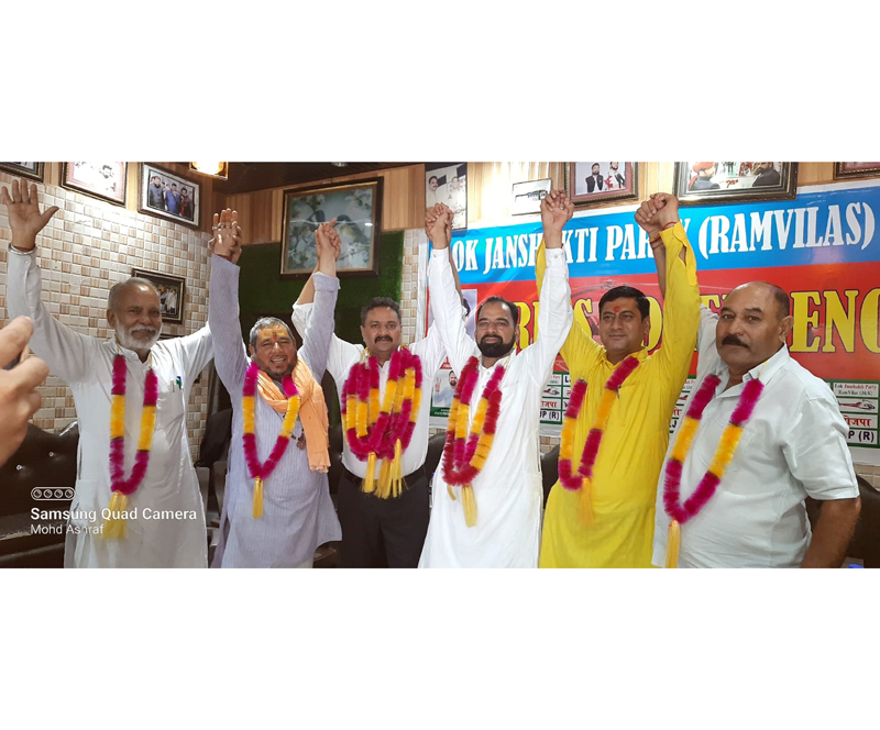 J&K leaders of Lok Janshakti Party (Ramvilas) pose for a group photograph after appointing Rajiv Gorka as president of Legal Cell of LJP (R). J&K leaders of Lok Janshakti Party (Ramvilas) pose for a group photograph after appointing Rajiv Gorka as president of Legal Cell of LJP (R).
