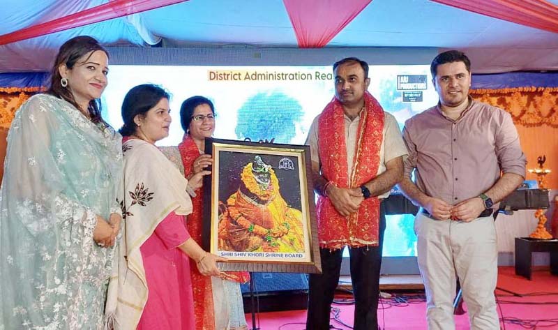 DC Reasi, Babila Rakwal presenting a religious painting to Div Com Jammu, Ramesh Kumar at Ransoo, Reasi on Monday. DC Reasi, Babila Rakwal presenting a religious painting to Div Com Jammu, Ramesh Kumar at Ransoo, Reasi on Monday.