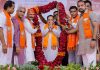 BJP National President JP Nadda being garlanded during a public meeting, in Godhra.