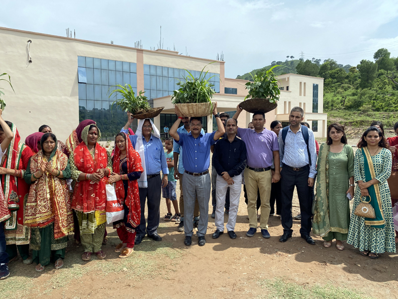Rector Udhampur campus and others carrying `Raade' in the form of a procession for immersion in the nearby stream. Rector Udhampur campus and others carrying `Raade' in the form of a procession for immersion in the nearby stream.