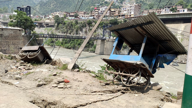 Sinking portion of Ramban-Maitra road near Jhulla Bridge on Monday. - Excelsior/Parvaz Mir Sinking portion of Ramban-Maitra road near Jhulla Bridge on Monday. - Excelsior/Parvaz Mir