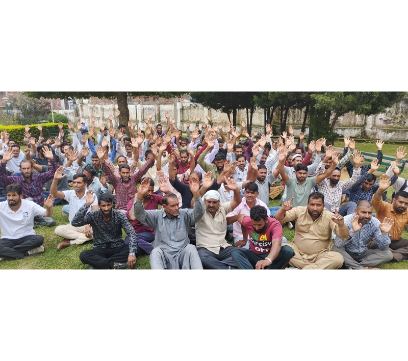 PDD workers stating protest dharna in Rajouri. — Excelsior/Imran PDD workers stating protest dharna in Rajouri. — Excelsior/Imran