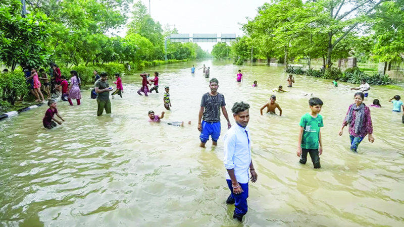 Locals taking bath in floodwater of the swollen Yamuna river at Raj Ghat, in New Delhi. Locals taking bath in floodwater of the swollen Yamuna river at Raj Ghat, in New Delhi.