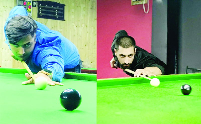 Erhaam Mir (left) and Freem Shala (right) aiming for their targets during junior Snooker matches at Srinagar on Friday. Erhaam Mir (left) and Freem Shala (right) aiming for their targets during junior Snooker matches at Srinagar on Friday.