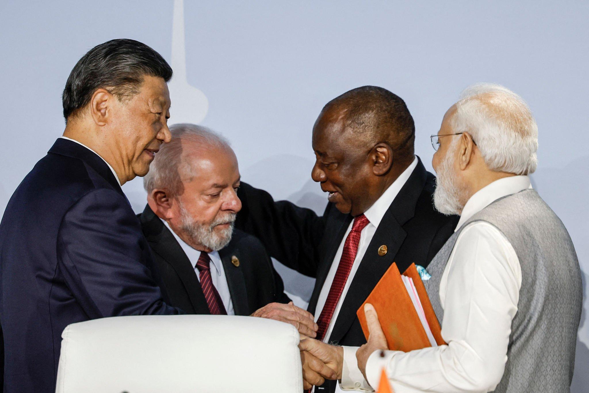 Modi, Xi Seen Having Brief Exchanges In Johannesburg Modi, Xi Seen Having Brief Exchanges In Johannesburg