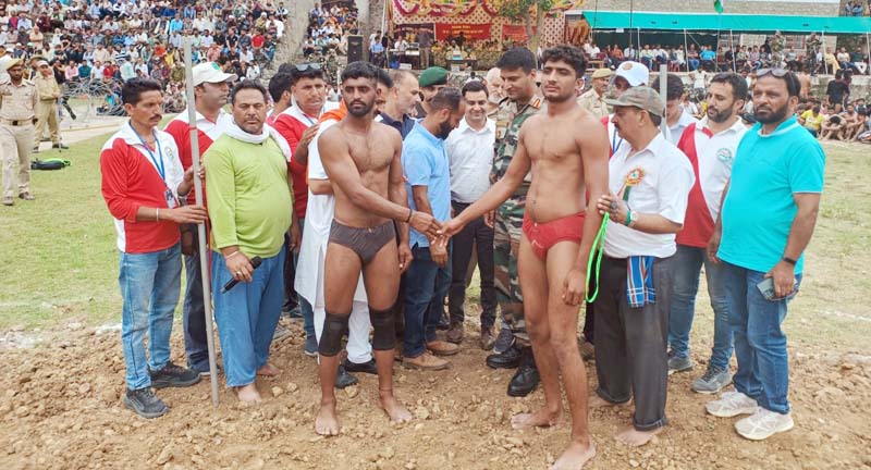 Wrestlers being introduced before competition in Bhaderwah. Wrestlers being introduced before competition in Bhaderwah.