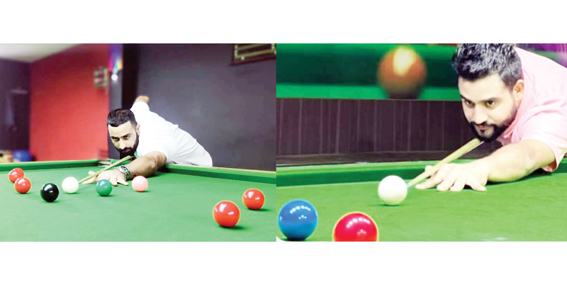 Mudassir Ashiq (Left) and Adnan Khan (Right) aiming at their targets during Snooker matches in Srinagar. Mudassir Ashiq (Left) and Adnan Khan (Right) aiming at their targets during Snooker matches in Srinagar.