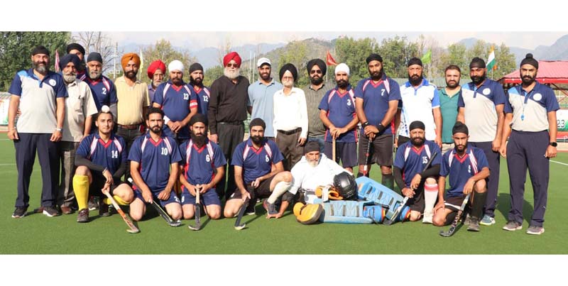 Kupwara Hockey team posing with dignitaries. Kupwara Hockey team posing with dignitaries.