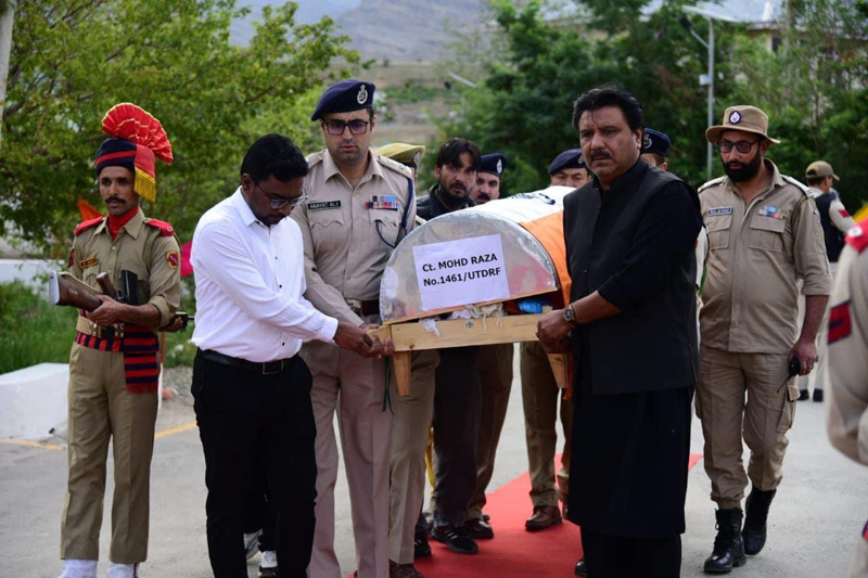 Body of martyred cop Mohd Raza being brought to Kargil from SKIMS Srinagar. -Excelsior/Basharat Ladakhi Body of martyred cop Mohd Raza being brought to Kargil from SKIMS Srinagar. -Excelsior/Basharat Ladakhi