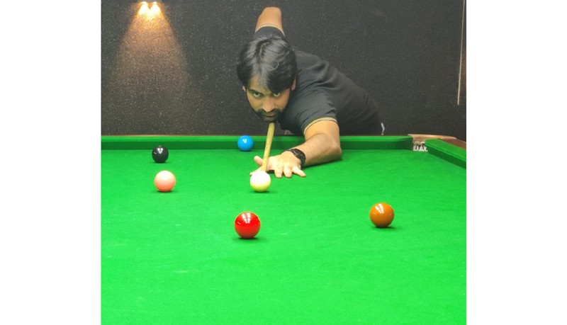 Younis Kuchey aiming at the target during quarterfinal Snooker league match at Srinagar. Younis Kuchey aiming at the target during quarterfinal Snooker league match at Srinagar.