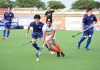 Players in action during a match between India and Japan.