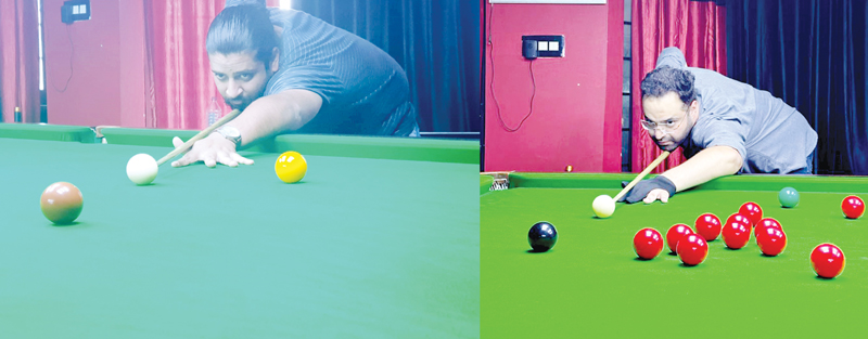 Haris Handa (Left) and Mujeeb Tramboo (Right) in action during Snooker matches at Srinagar on Saturday. Haris Handa (Left) and Mujeeb Tramboo (Right) in action during Snooker matches at Srinagar on Saturday.