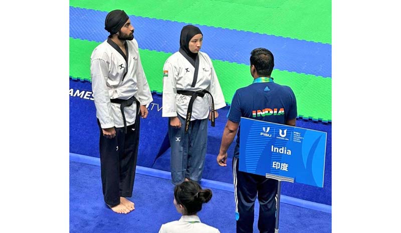 Ladakh's Shahnaz Parveen in group category with Kunwar Deep Singh of Punjab in Poomsae Taekwondo at Fisu World University Games in Chengdu, China. -Excelsior/Basharat Ladakhi Ladakh's Shahnaz Parveen in group category with Kunwar Deep Singh of Punjab in Poomsae Taekwondo at Fisu World University Games in Chengdu, China. -Excelsior/Basharat Ladakhi