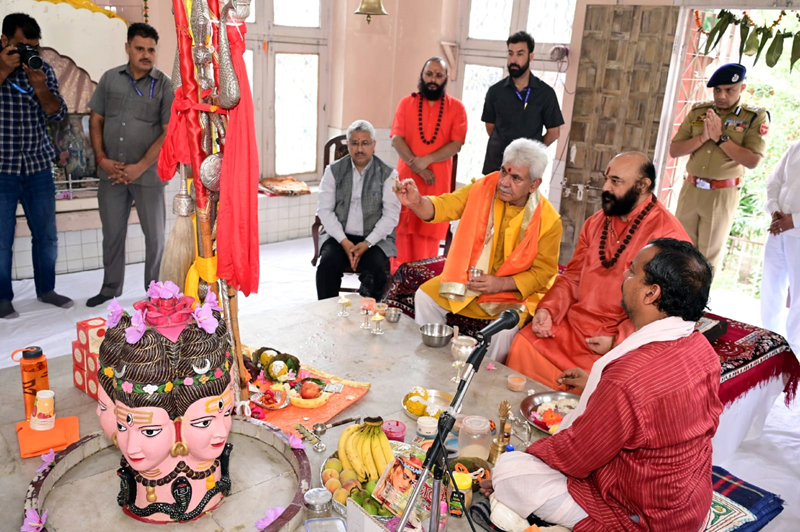 Lt Governor, Manoj Sinha performing Puja of Shri Amarnath Ji Chhari at Dashnami Akhara on Thursday. Mahant Deependra Giri Ji, the custodian of holy mace, is also seen in the picture. -Excelsior/Shakeel Lt Governor, Manoj Sinha performing Puja of Shri Amarnath Ji Chhari at Dashnami Akhara on Thursday. Mahant Deependra Giri Ji, the custodian of holy mace, is also seen in the picture. -Excelsior/Shakeel