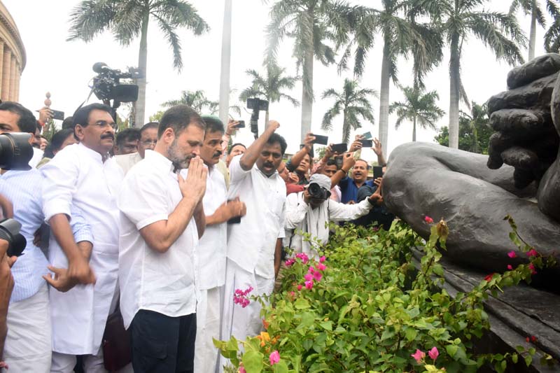 Congress MP Rahul Gandhi paying tribute to Mahatma Gandhi at Parliament House complex on arrival at Parliament house during Monsoon Session, in New Delhi on Monday. (UNI) Congress MP Rahul Gandhi paying tribute to Mahatma Gandhi at Parliament House complex on arrival at Parliament house during Monsoon Session, in New Delhi on Monday. (UNI)