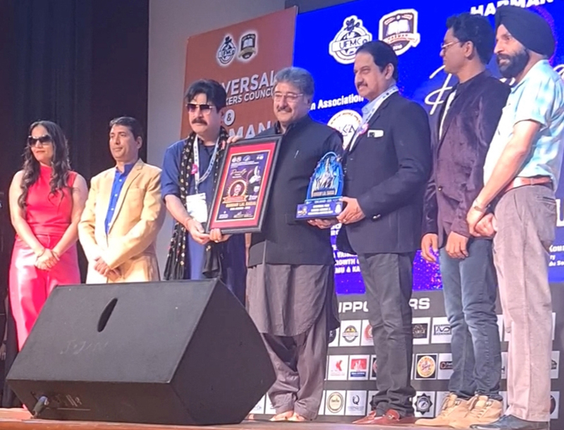 Filmmaker Mushtaaque Ali Ahmad Khan receiving award at International Film Festival of J&K at Katra. Filmmaker Mushtaaque Ali Ahmad Khan receiving award at International Film Festival of J&K at Katra.