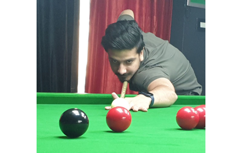 Waseem Iqbal aims at target in a Snooker match against Umer Mushtaq at Srinagar on Thursday. Waseem Iqbal aims at target in a Snooker match against Umer Mushtaq at Srinagar on Thursday.