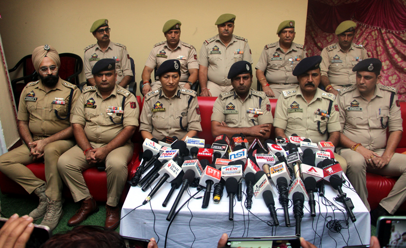 SSP Jammu, Chandan Kohli, flanked by other officers, addressing media persons at Police Station Trikuta Nagar in Jammu on Friday. SSP Jammu, Chandan Kohli, flanked by other officers, addressing media persons at Police Station Trikuta Nagar in Jammu on Friday.