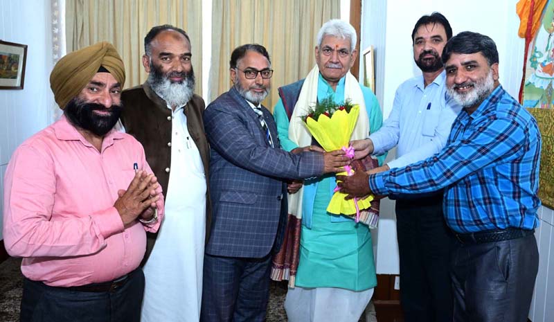 Lt Governor receiving bouquet from delegation of National Awardee Teachers. Lt Governor receiving bouquet from delegation of National Awardee Teachers.