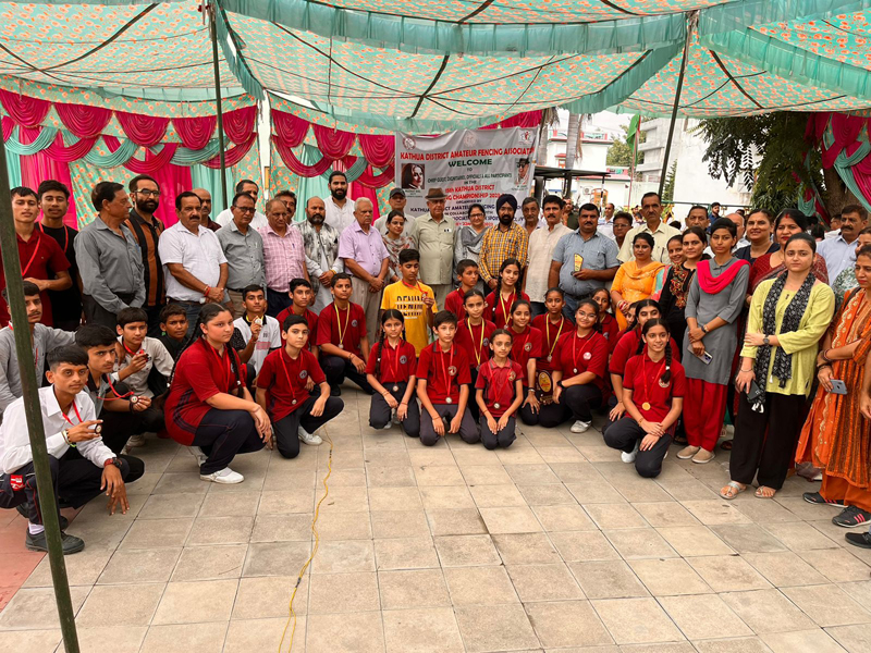 Fencers displaying medals while posing with dignitaries. Fencers displaying medals while posing with dignitaries.