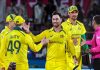 Australian players celebrate after winning the 3rd ODI against India at Saurashtra Cricket Association Stadium in Rajkot on Wednesday.