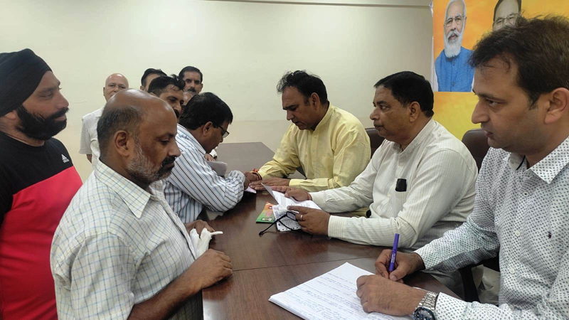 Former Minister, Sat Sharma and other BJP leaders listening public grievances at party office Jammu on Wednesday Former Minister, Sat Sharma and other BJP leaders listening public grievances at party office Jammu on Wednesday